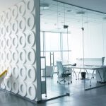 What are the uses and benefits of glass partitions?